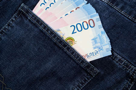 Russian money is in jeans pocket in denominations of 2000 rubles.の写真素材