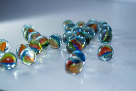 Colored balls on a white wooden background.の写真素材