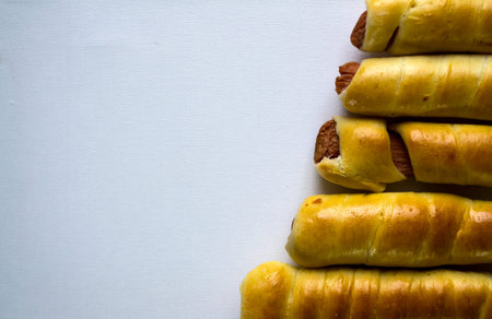 Sausages in dough on a white background, fast food.