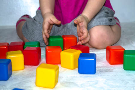 The child plays in cubes, the development of the child.の写真素材
