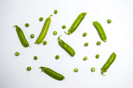 Green peas pattern. Top view, flat lay. Green peas isolated on white background.の写真素材