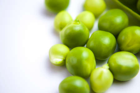 Young green peas closeup view backgroundの写真素材