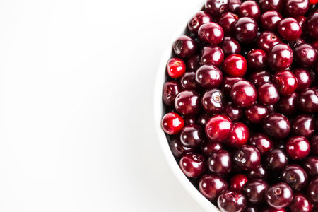 Ripe cherry on a white background. Place for the inscription in your article about the benefits of...