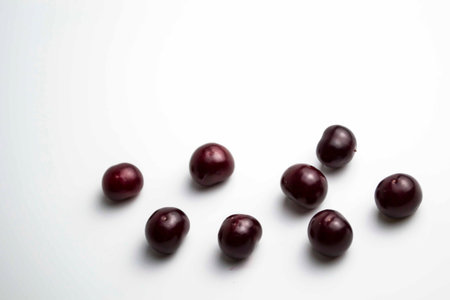 Ripe cherry on a white background. Place for the inscription in your article about the benefits of...