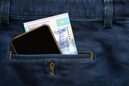 In Jeanss pocket is a phone and ten thousand tenge, a shopping trip, a telephone connection.