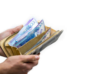 tenge. Open wallet with different bills of money.の写真素材