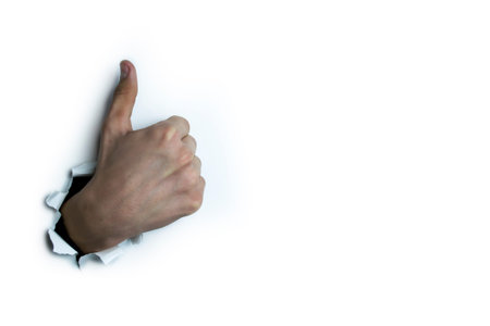 Thumb at the top on a white background.の写真素材