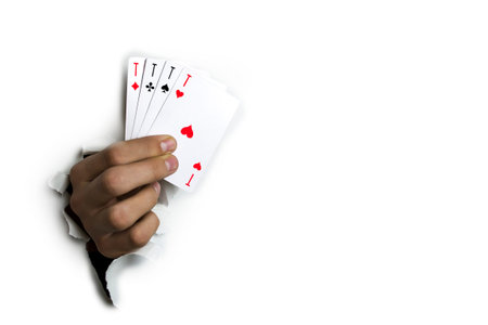 Four aces in his hand on a white background.