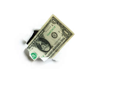 One dollar sticking out of a hole on a white background, incomplete income.の写真素材