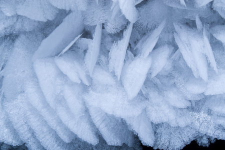 The texture of frozen snowflakes on the ceiling of the cave.
