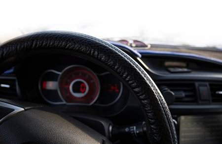 Close-up car steering wheel, car panel.