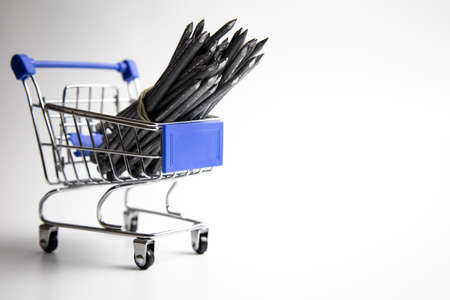 Nails lie in the division on a white background.の写真素材