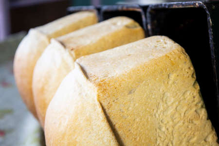 Fresh cooked hot bread fell out of the mold.の写真素材