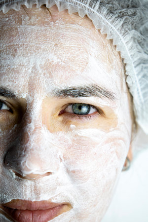 Cream mask on the face of the girl, rejuvenating face mask.