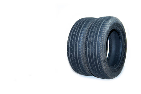 Summer tires on a passenger car on a white background