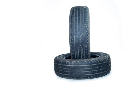 Summer tires on a passenger car on a white background