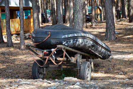 An inflatable boat ready to travel on the lake, a fishermans boat.の写真素材
