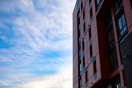 Bottom up view on new modern residential buildings made of red and yellow brick. Medium-rise residential building. High quality photoの写真素材