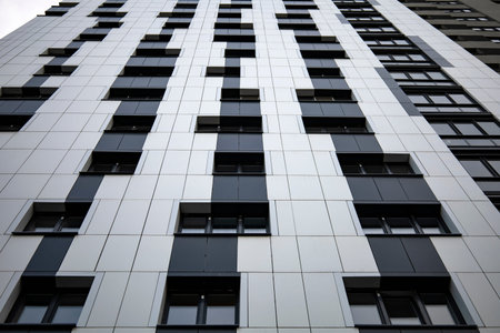 Bottom up view on new modern residential buildings made of red and yellow brick. Medium-rise...