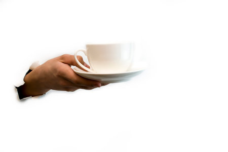 Hand holding a Coffee cup isolated on white background. High quality photoの写真素材