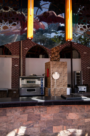 In this spacious kitchen, you will find two separate ovens for your culinary adventures and a stylish clock perfectly placed on the counterの写真素材