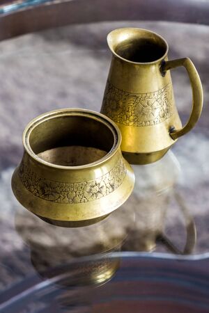 Old bronze jug and sugar bowl, close-up.の写真素材