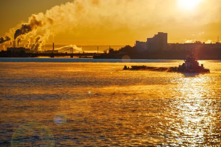 Early morning, low sunshine painted the terrain in warm orange tones, from the surface of the river...