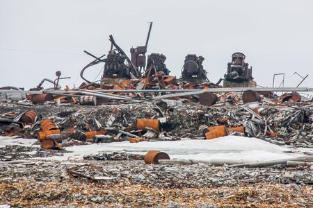 Abandoned transport, equipment and buildings of the Russian polar station, the Novaya Zemlya Archipelago, the Arctic.の写真素材