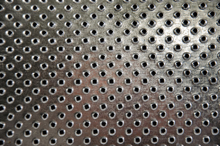 Abstract surface of metal grater as a backgroundの写真素材