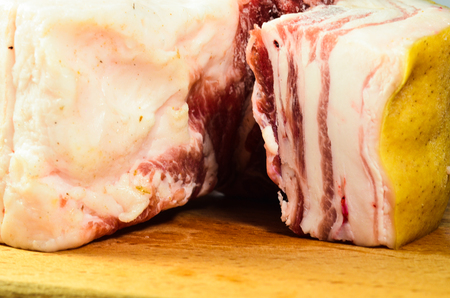 Fresh raw pork belly on a wooden boardの写真素材