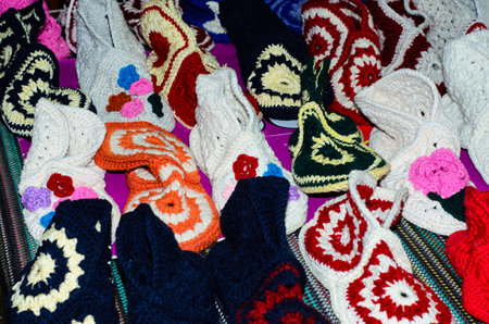 Knitted slippers laid out on the counterの写真素材