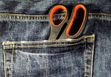 Scissors in a pocket of the blue jeansの写真素材
