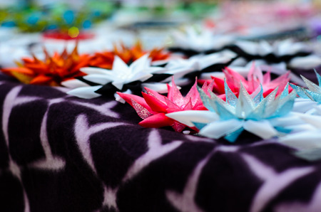 Different multicolored abstract artificial flowers on a tableの写真素材