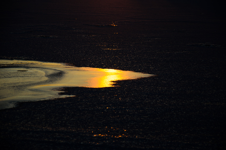 Beautiful winter sunset on a river Dnieperの写真素材