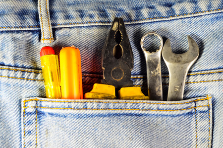 Different hand tools in a pocket of the blue jeansの写真素材