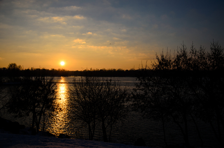 Beautiful winter sunset on a river Dnieperの写真素材