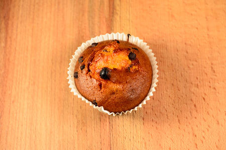 Fresh cupcake on the old wooden tableの写真素材