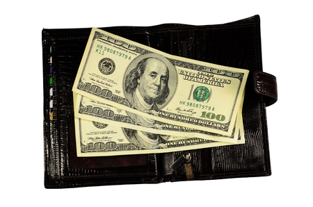 Brown leather wallet with the one hundred dollars banknotes isolated on a white backgroundの写真素材