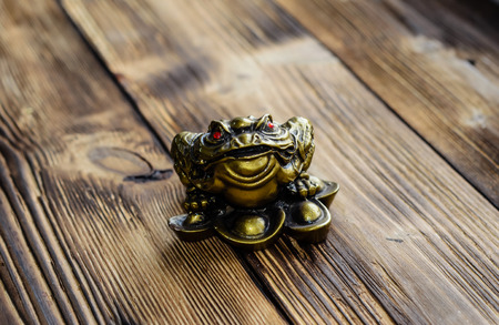 Chinese lucky toad on a wooden backgroundの写真素材