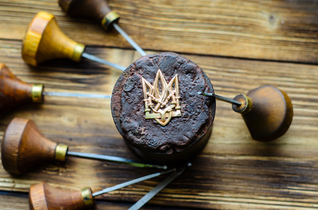 Different gravers and trident on a jewelry tableの写真素材