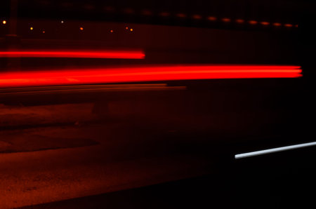 Trails of the car lights on night road