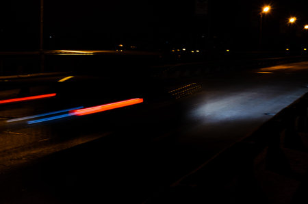 Trails of the car lights on night road