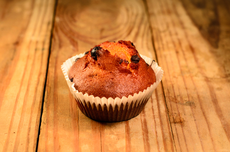 Fresh cupcake on the old wooden tableの写真素材
