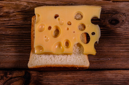 Sandwich with cheese on rustic wooden tableの写真素材