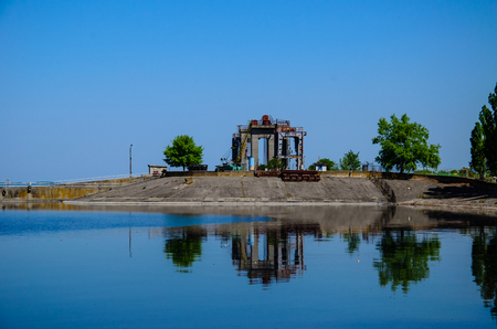 Buildings of the hydraulic power plant on lakeの写真素材