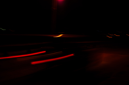 Trails of the car lights on night roadの写真素材