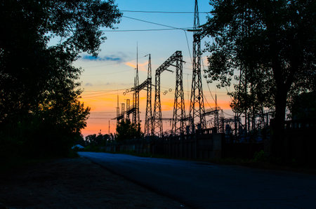 Silhouette of the power transmisson towers at sunset