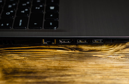 Modern laptop on the rustic wooden table