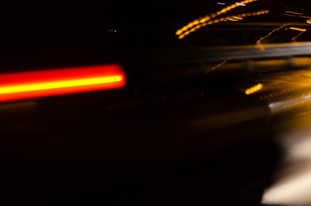 Trails of the car lights on night roadの写真素材