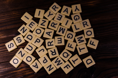 Different random letters on rustic wooden tableの写真素材